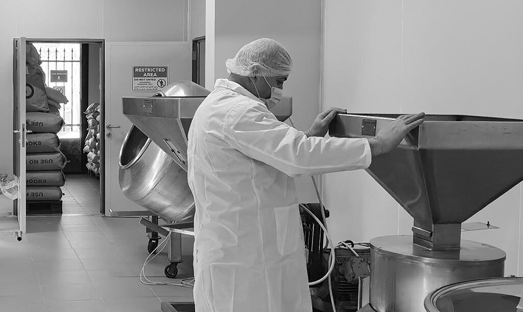 Production facilities with stainless steel machineries and employees